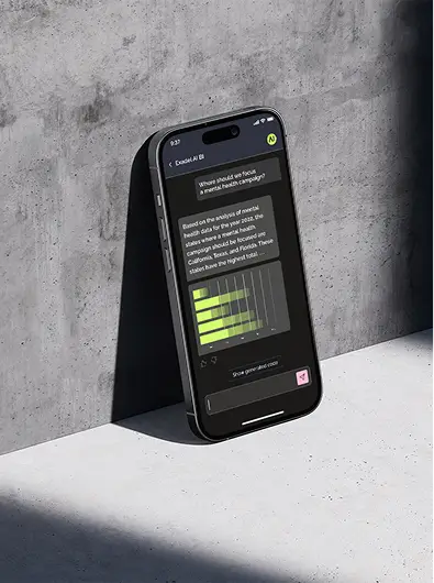 A cell phone sitting on top of a cement wall.