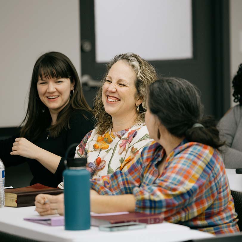 Students laughing during class at KINEO