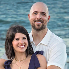 John Ronan headshot, with wife at beach.