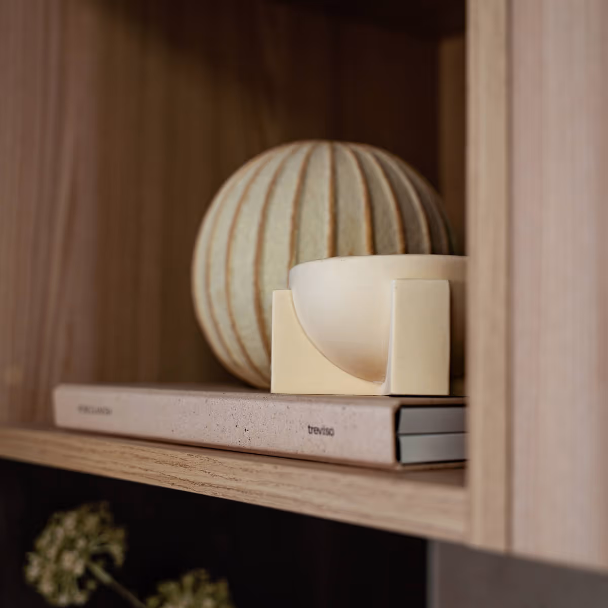 Close up of a decorated shelving unit inside a home