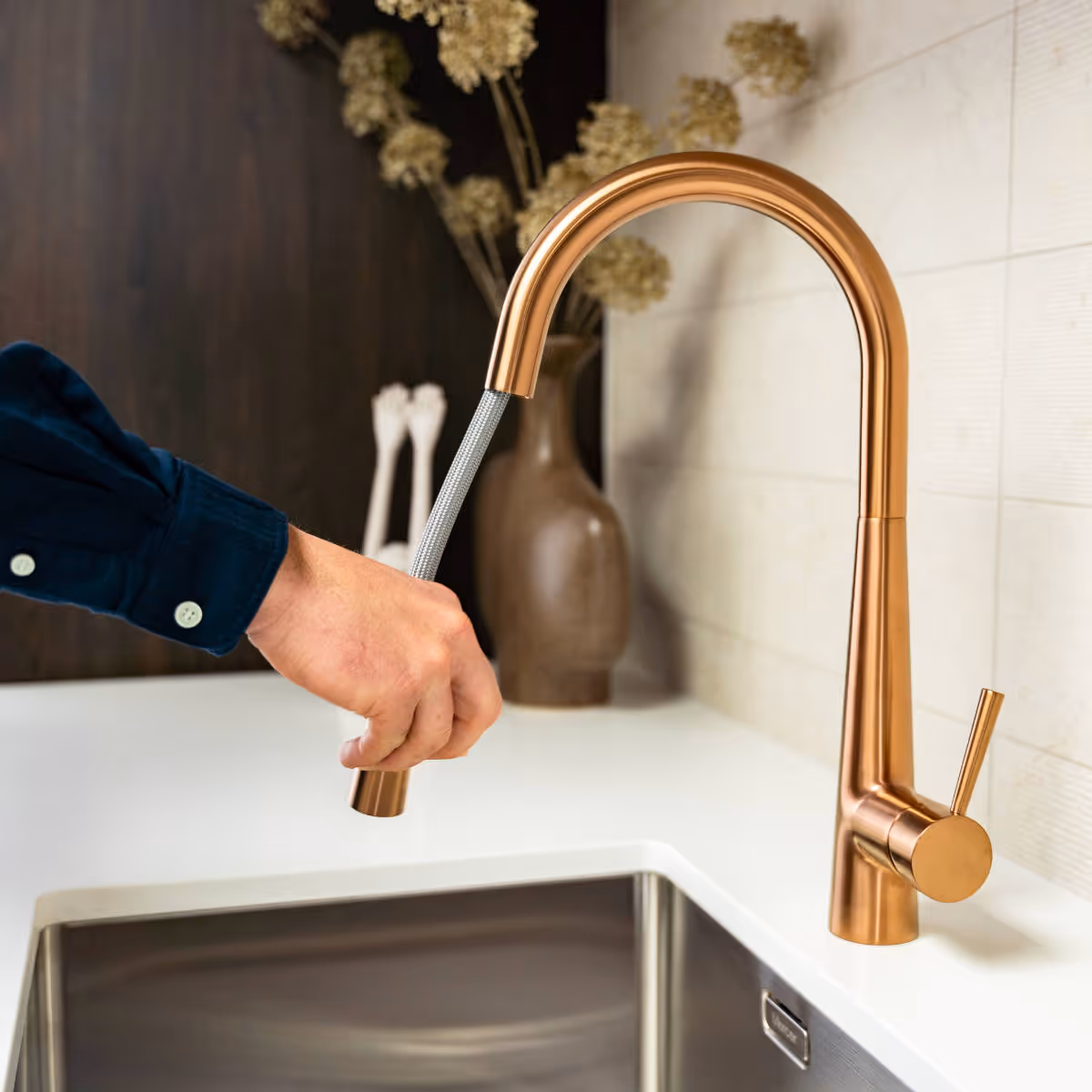 Close up of copper tap, with washer extension extended