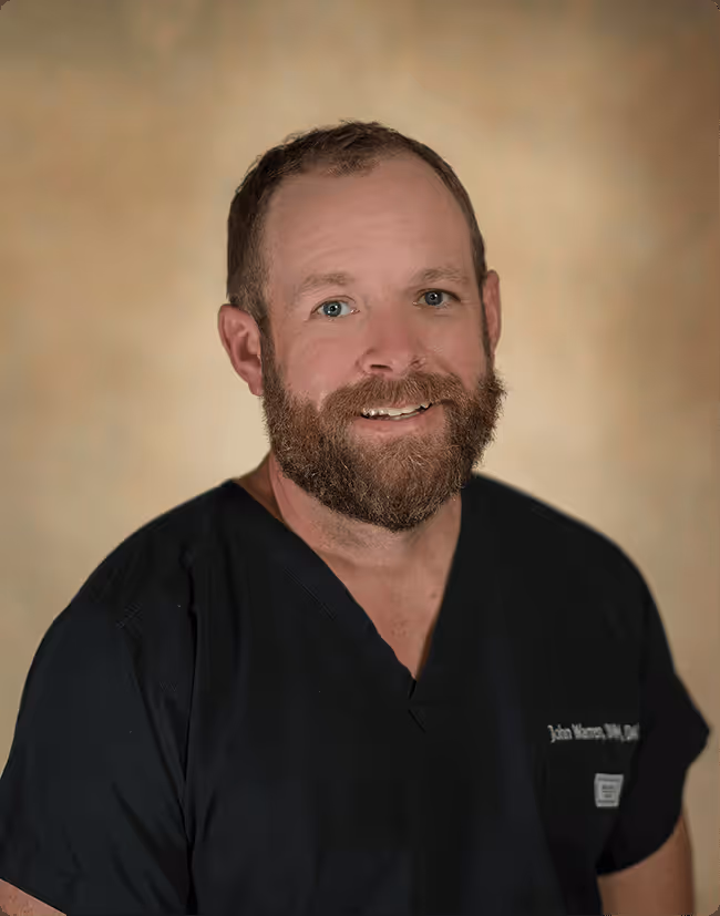 A man with a beard wearing a black shirt.