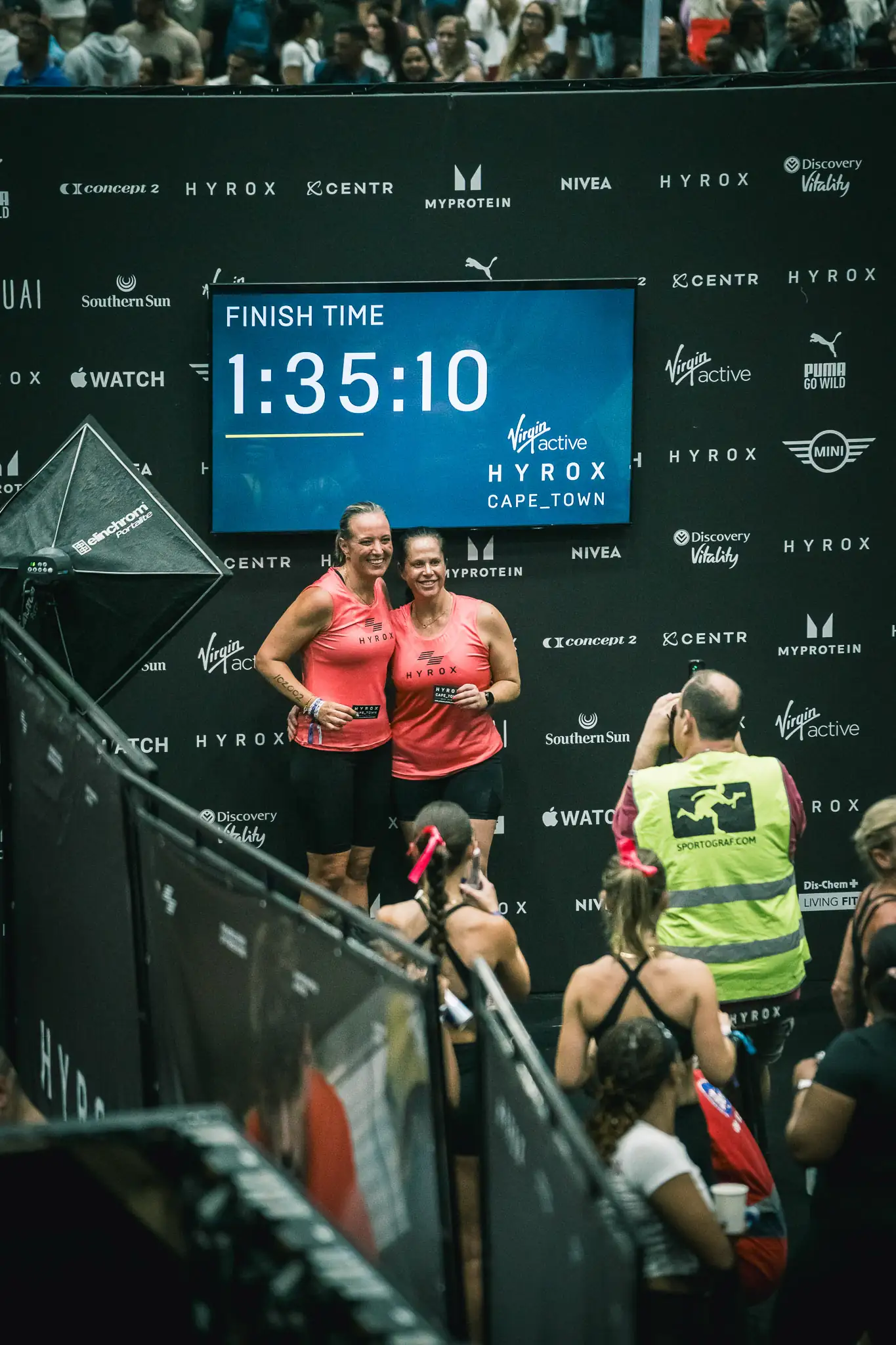 HYROX competitor with the race clock — HYROX race photographer Cape Town