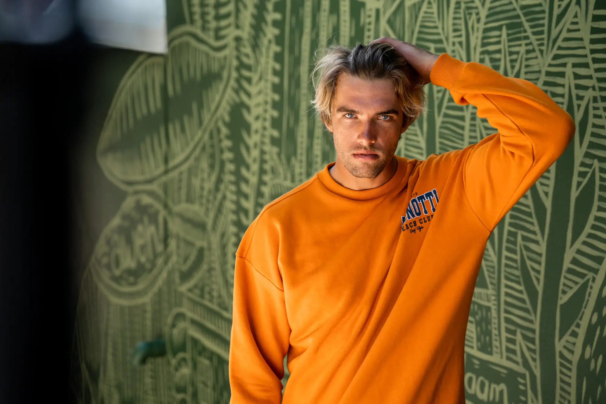Male brand portrait against a green backdrop — brand portrait photographer Cape Town