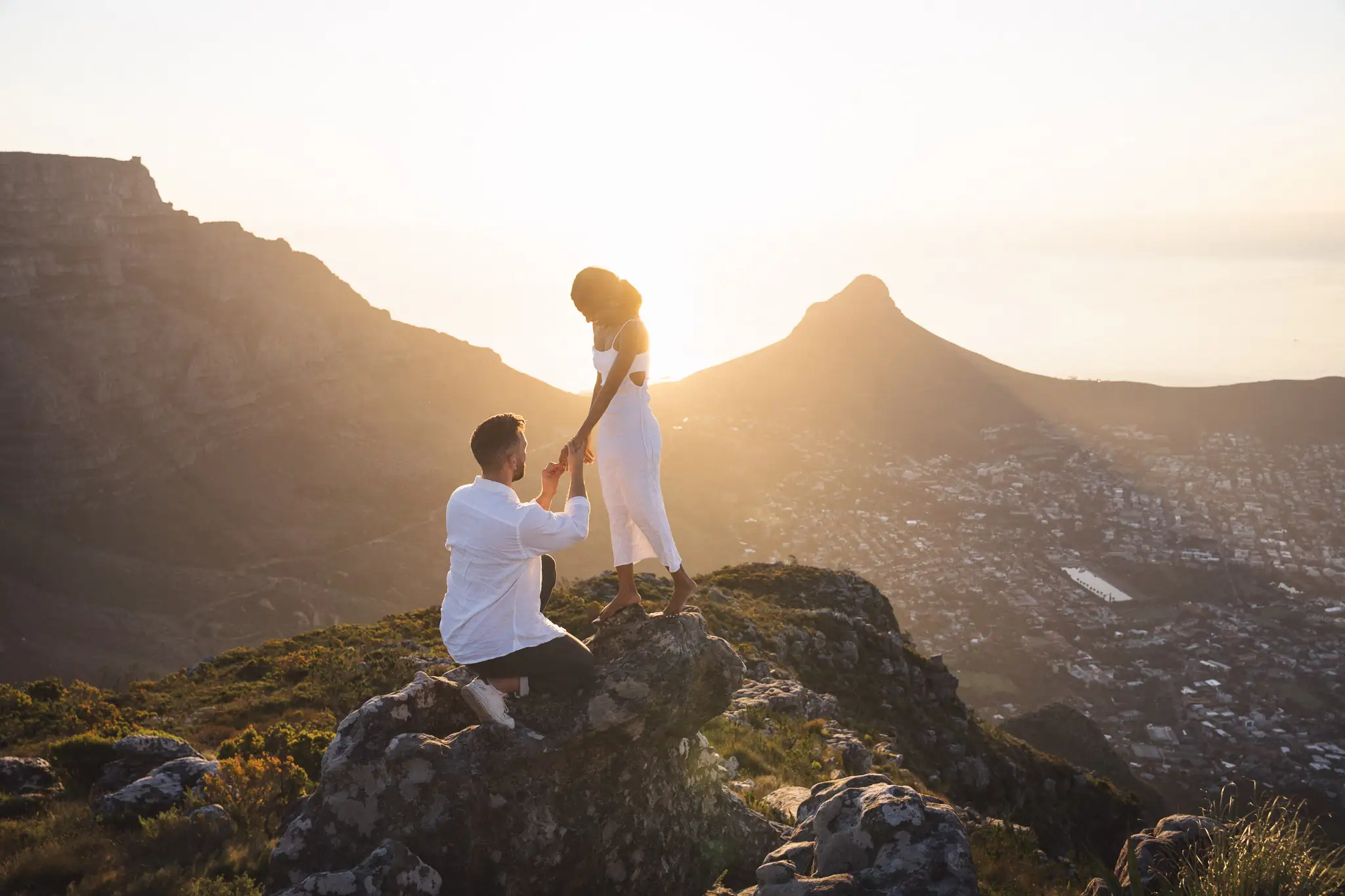 Proposal on a mountainside above Cape Town at sunset — engagement photographer Cape Town