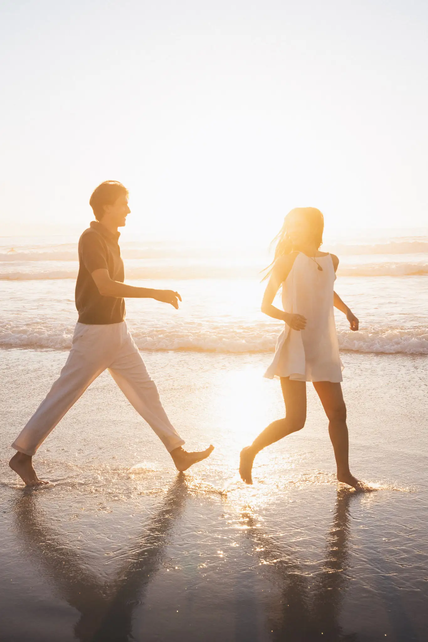 Couple walking along the shoreline at Glen Beach — couple photographer Cape Town