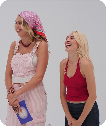 Two women laughing and chatting at Love at First Sign dating experience.