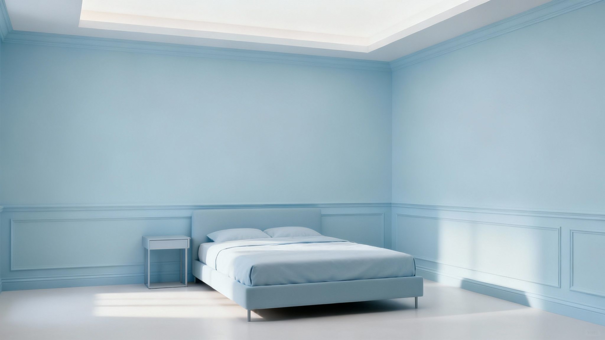 A bright, airy room with light-coloured walls and furniture, demonstrating how colour can make a small space feel larger.