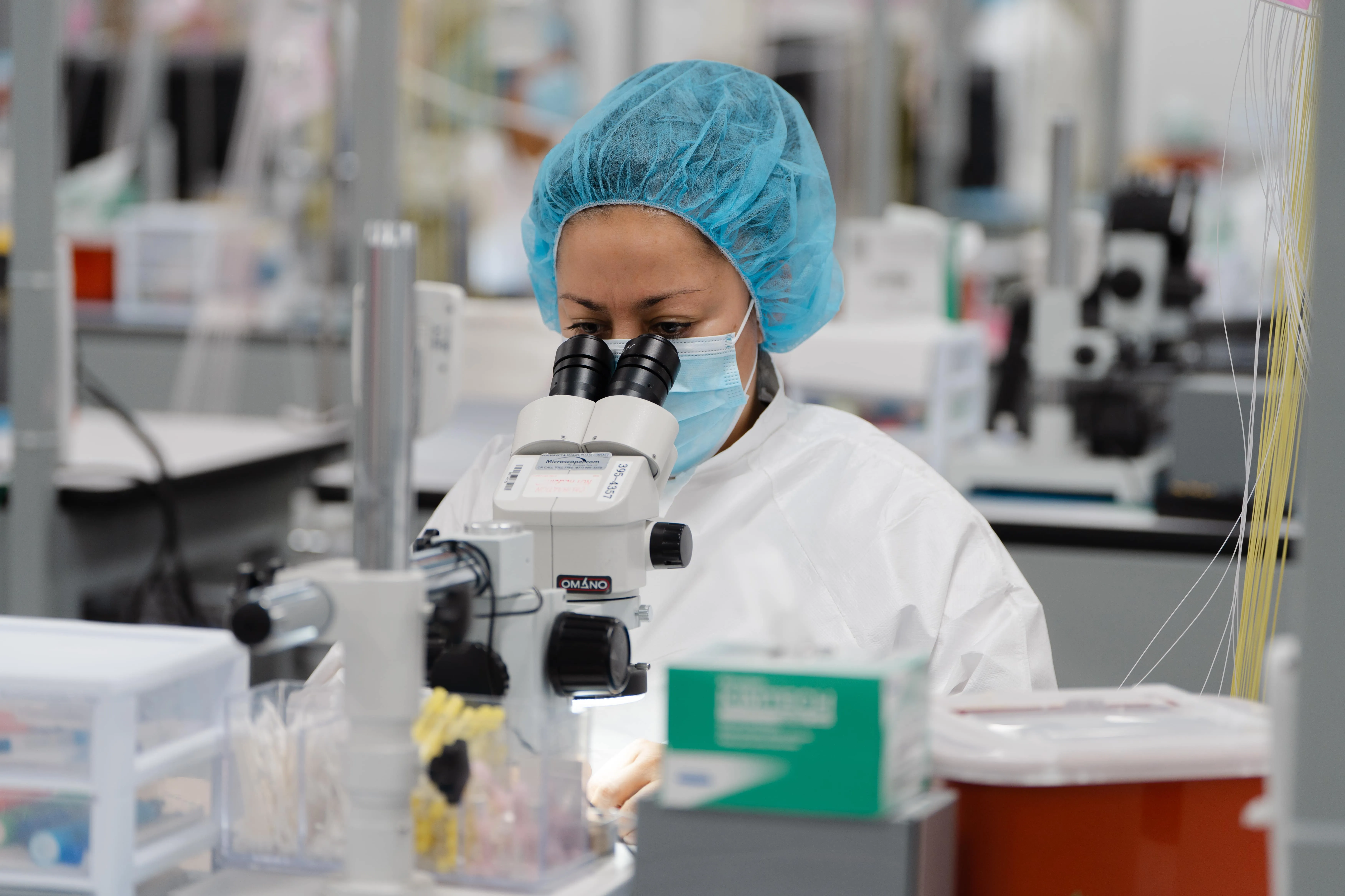 A Millar employee works in Millar’s ISO Class 7 clean room to examine the performance of a newly developed medical device.