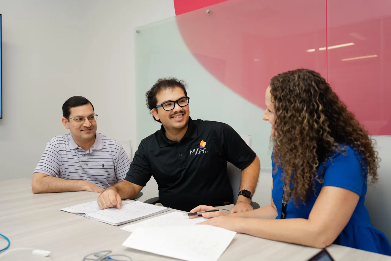 Millar employees during a meeting at Millar headquarters.
