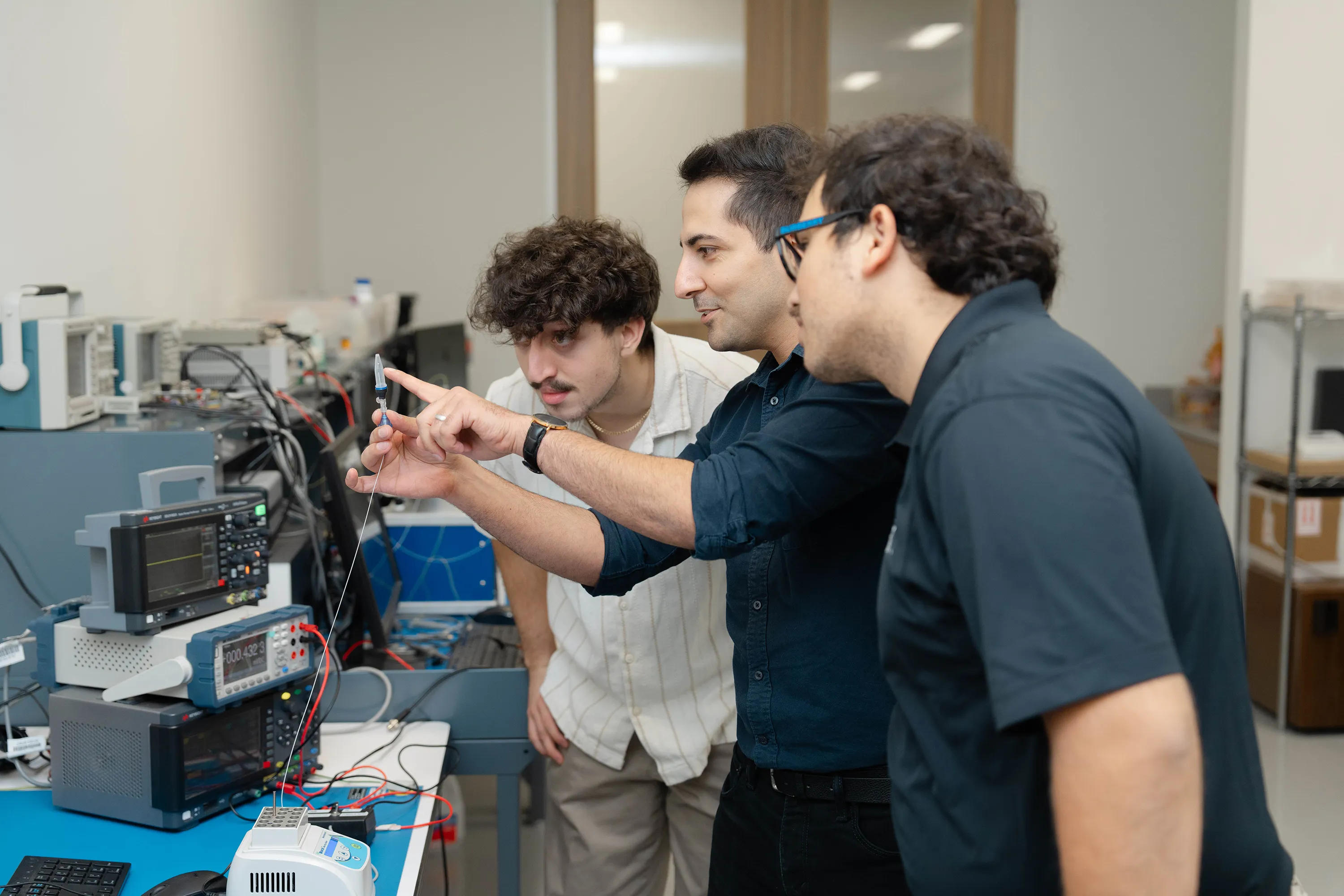 Millar employees examine an oxidation-reduction potential (ORP) sensor
