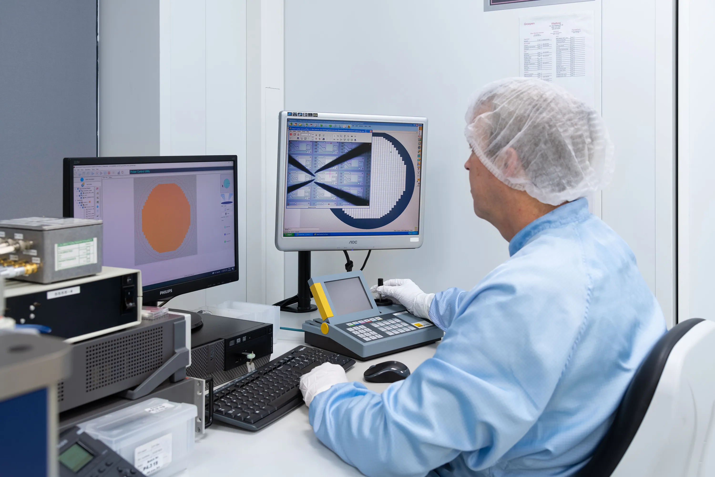 A Millar employee uses a computer to make precise adjustments to a device in Millar’s Microfoundry.