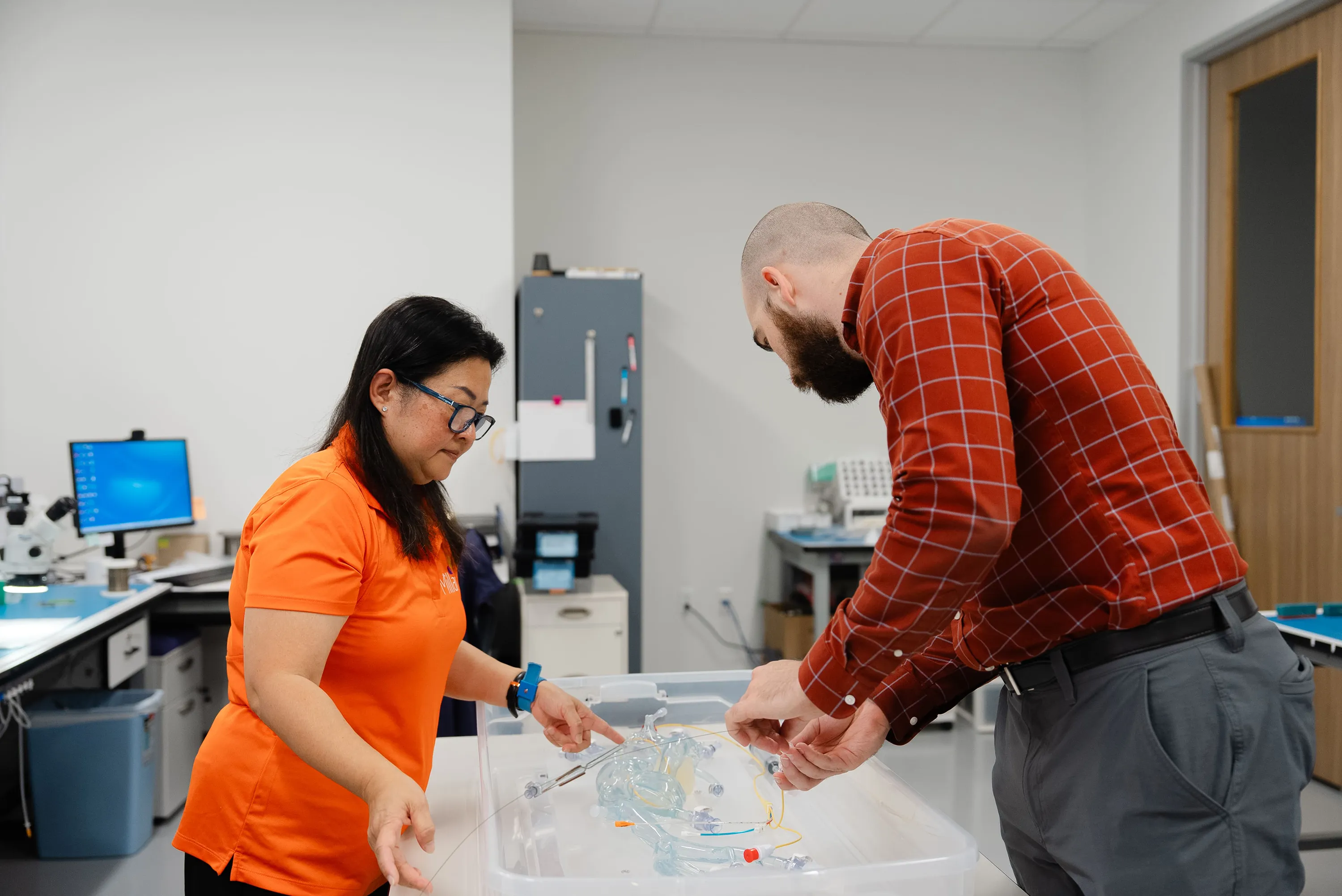 Millar employees work on a medical device prototype.
