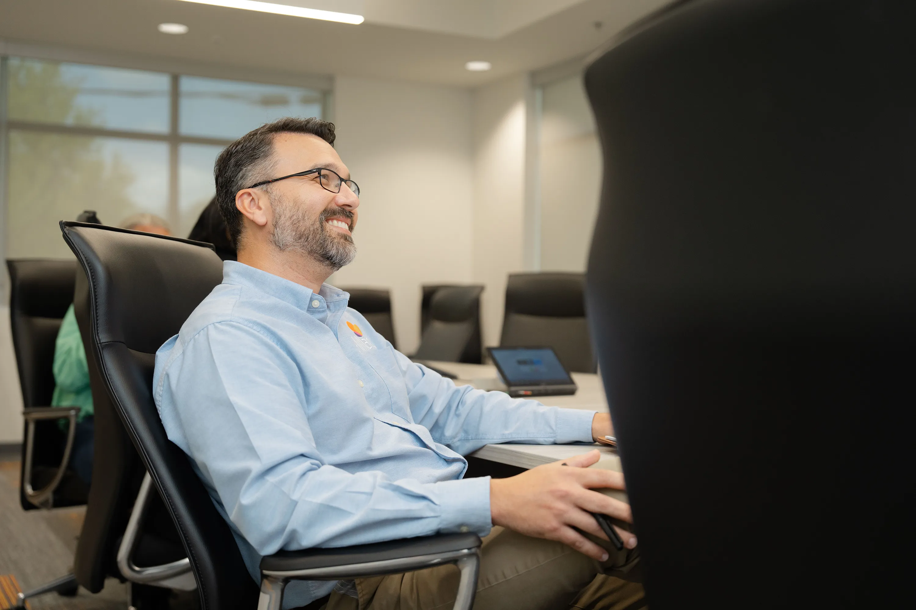 A member of Millar’s OEM Solutions Team smiles during a meeting at Millar’s headquarters.