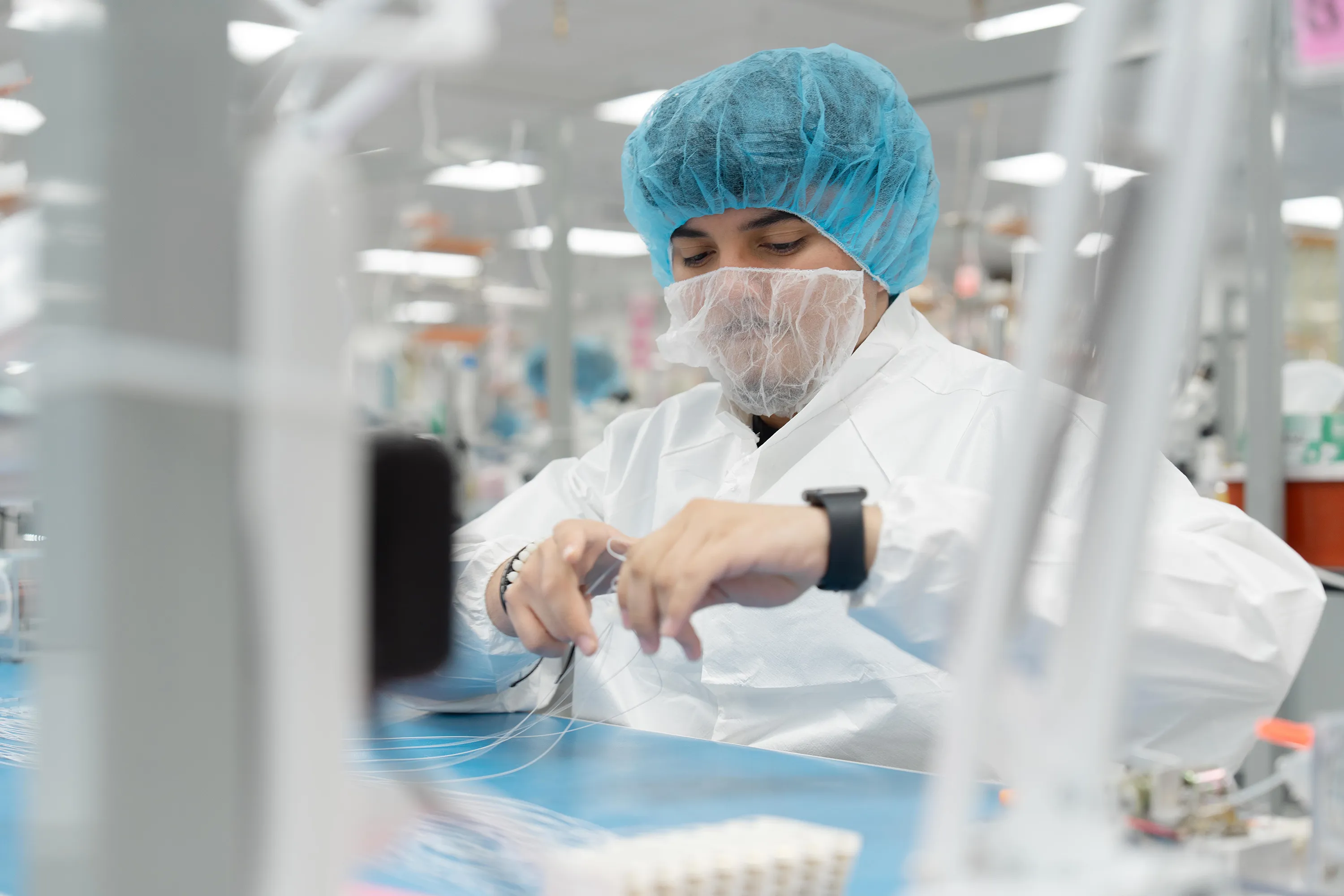 A Millar employee assembes a laboratory device in Millar’s ISO Class 7 clean room. 