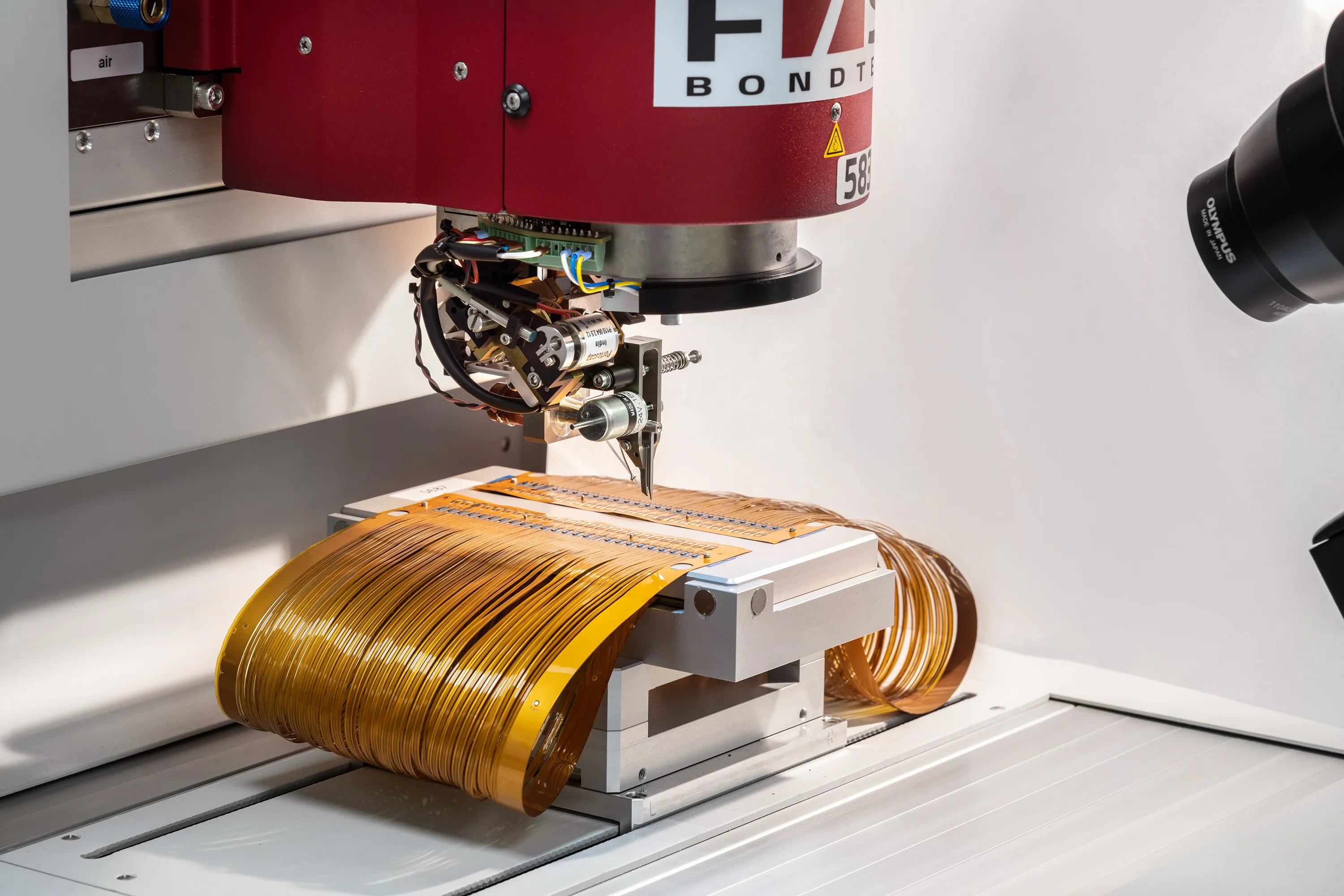A machine in Millar’s Microfoundry manufactures pressure sensors on a flexboard.