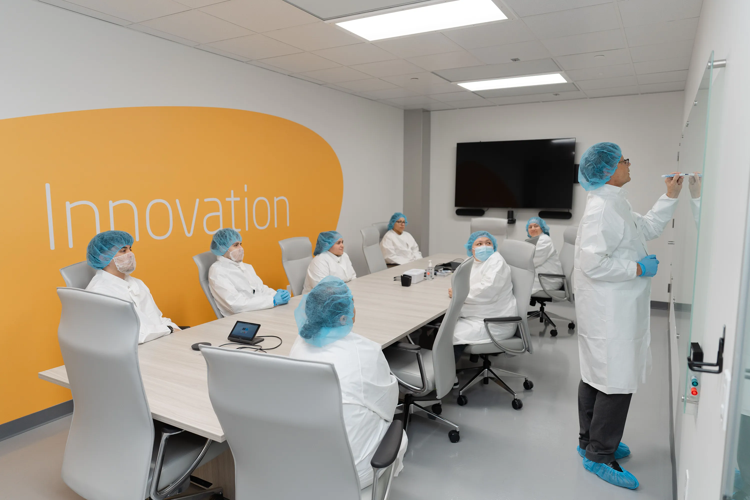Millar employees meet at Millar headquarters. 