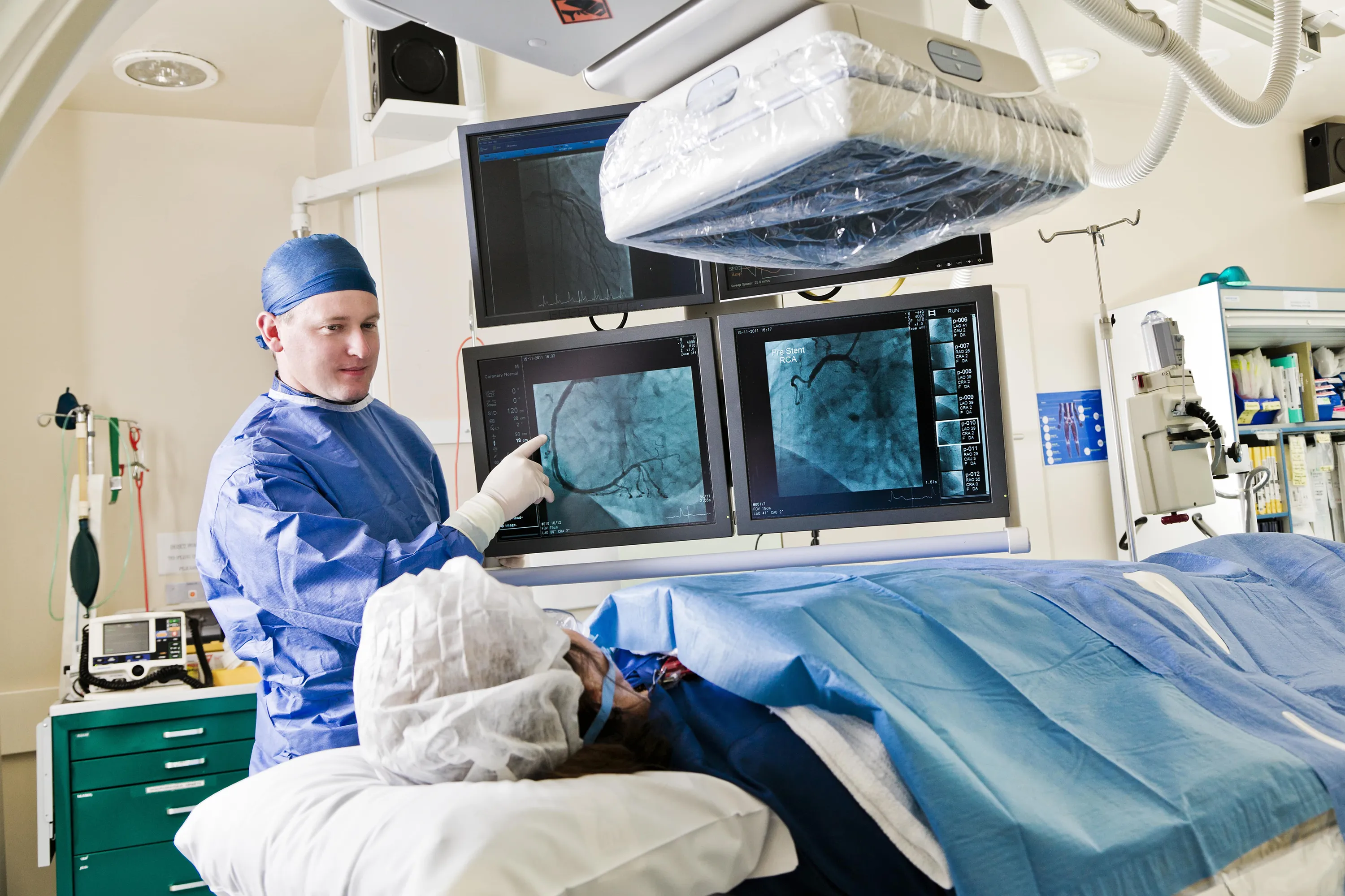 A doctor showing cardiovascular imagery to a patient in real time. 