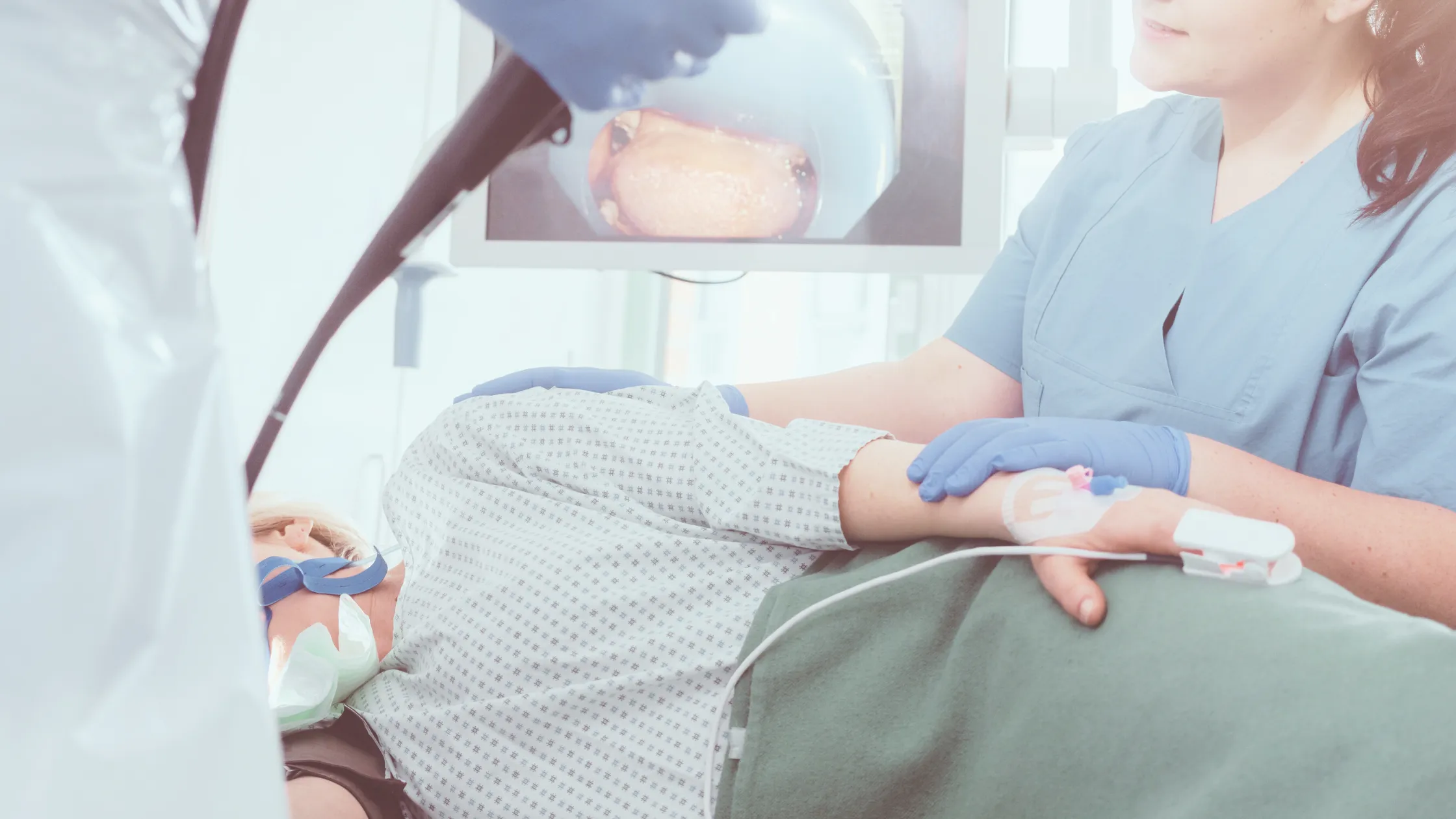 Clinician performing minimally invasive endoscopic procedure using advanced diagnostic technology.