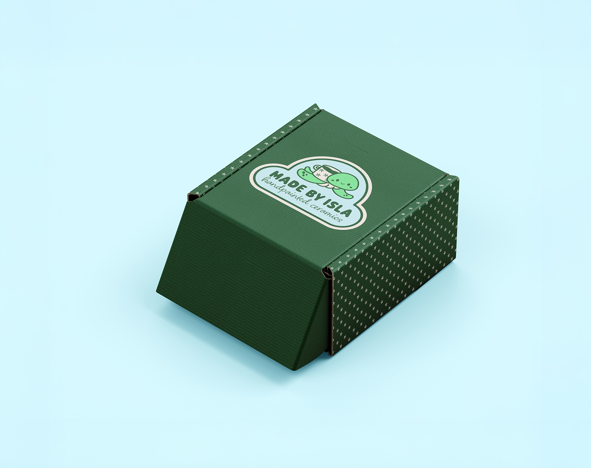 Made by Isla logo on green patterned cardboard box.