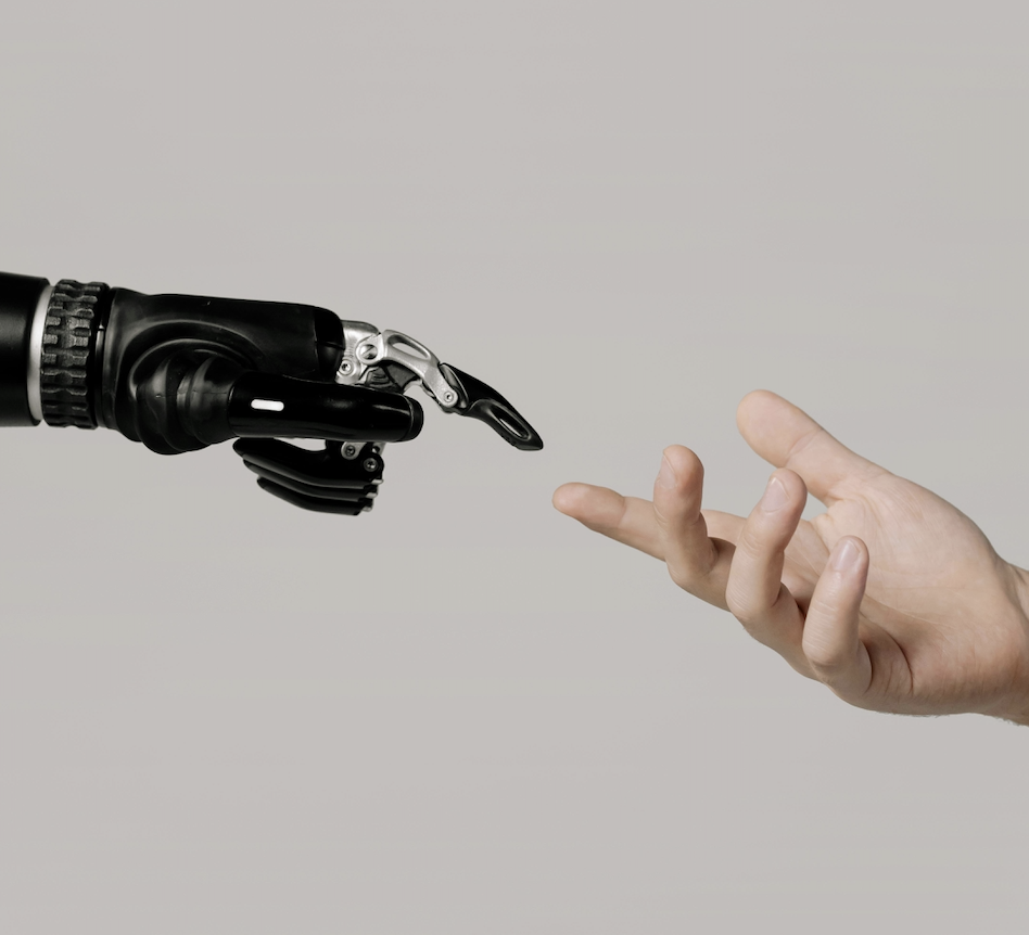 robot hand reaching out to human hand