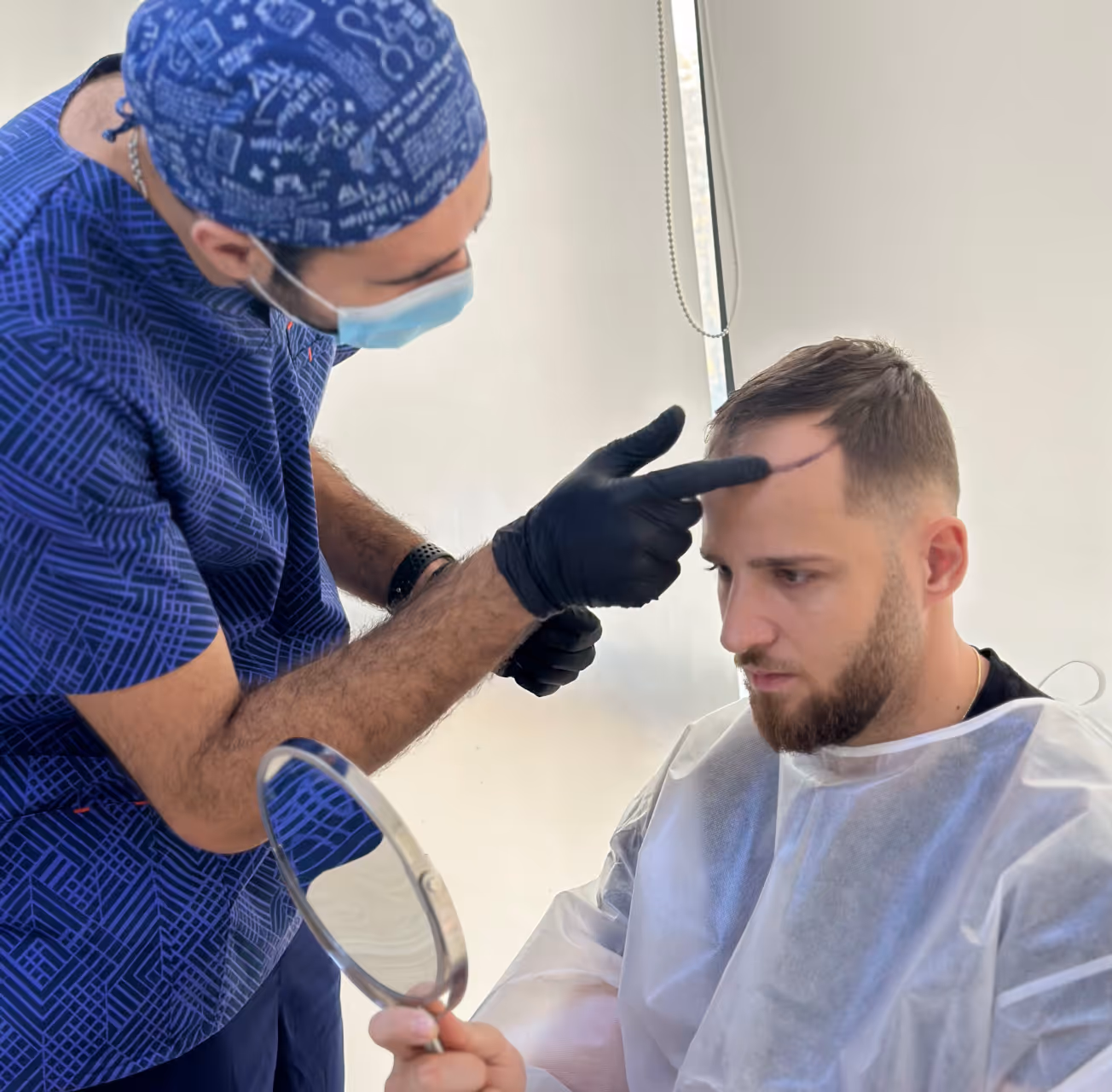 An image showing Estetime patient and Dr. Vanand during hair assessment.