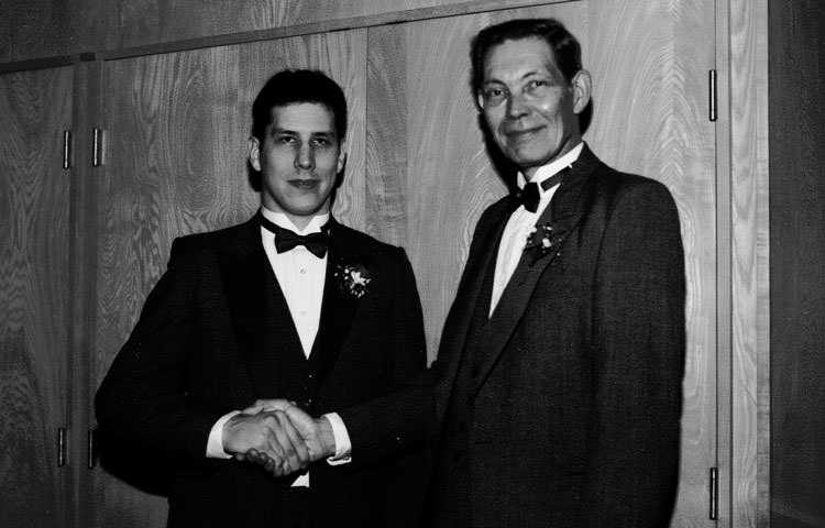 Jeff and Lewis Mohr shaking hands at Jeff's graduation