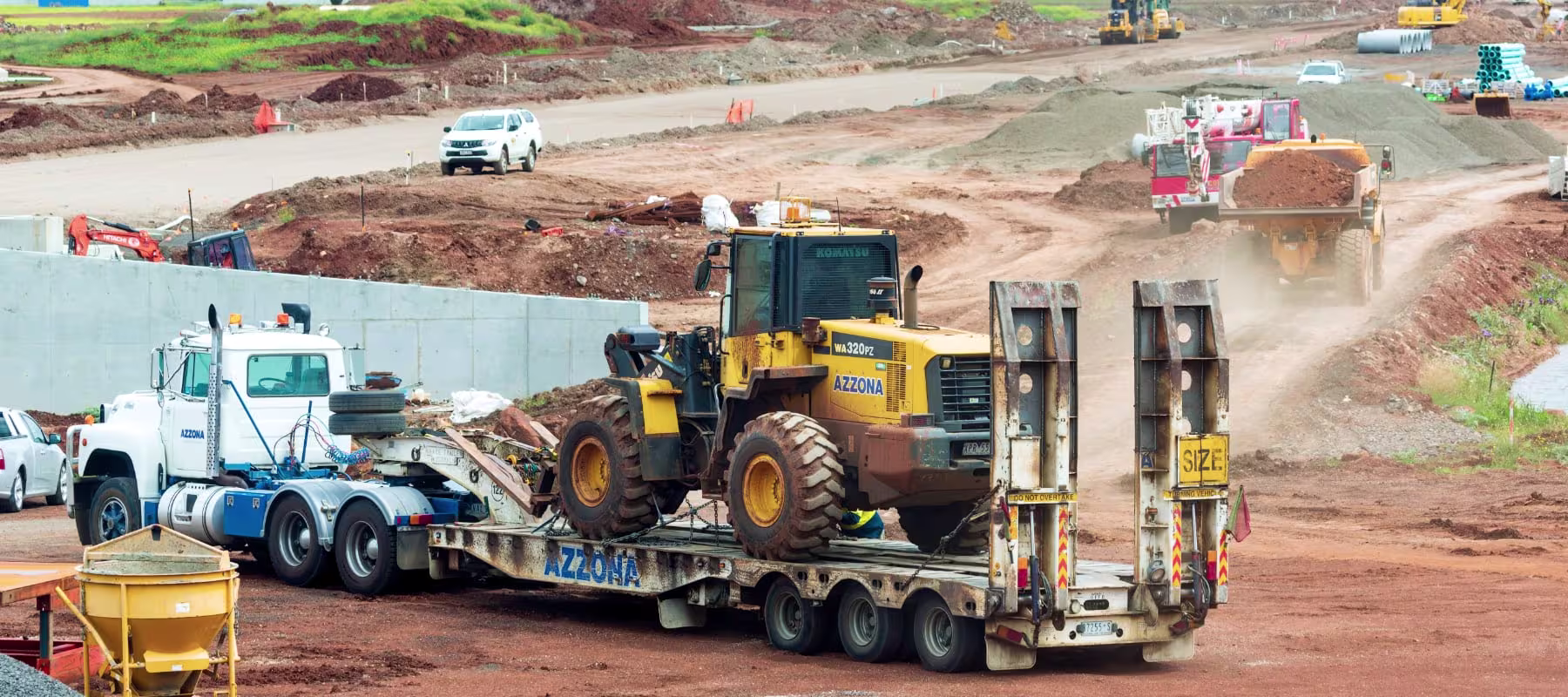 truck transporting bulldozer
