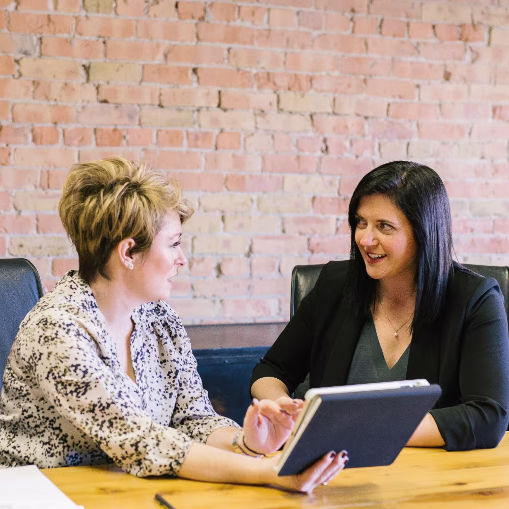 two businesswomen discussing insurance