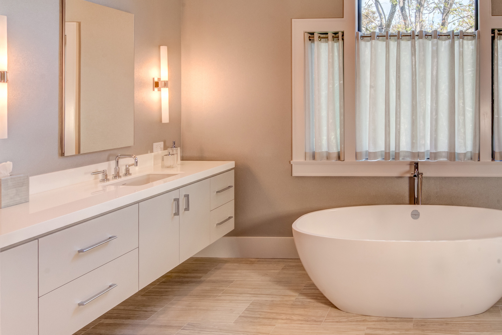 Bathroom with freestanding tub and double vanity.