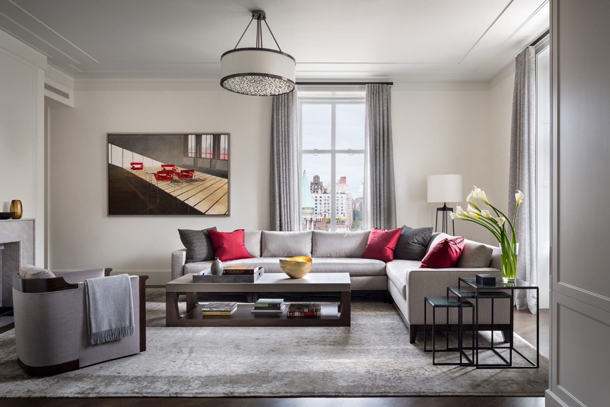 Living room with sofa, armchairs, and bright accents.