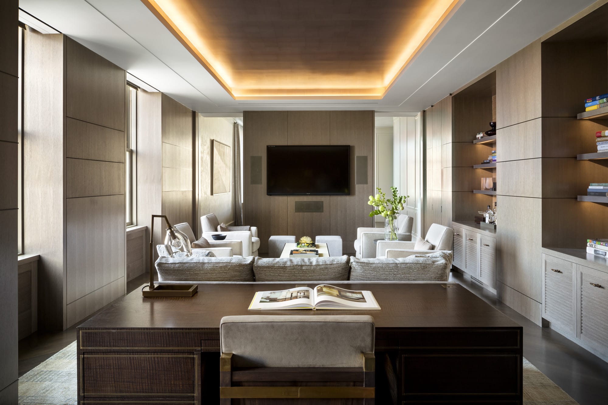 Dining area with wood accents and television.