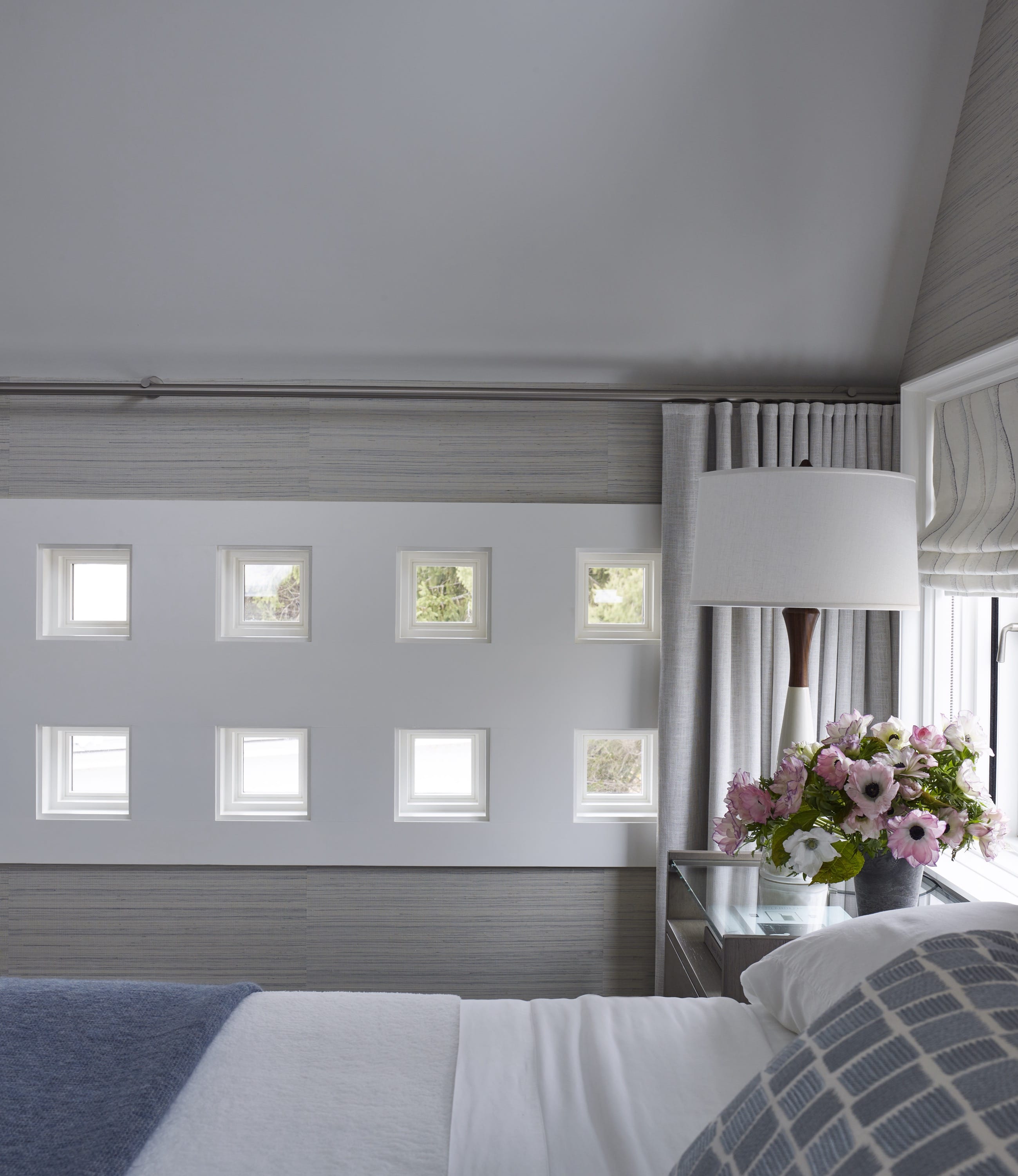 Bedroom with balcony doors and natural light.