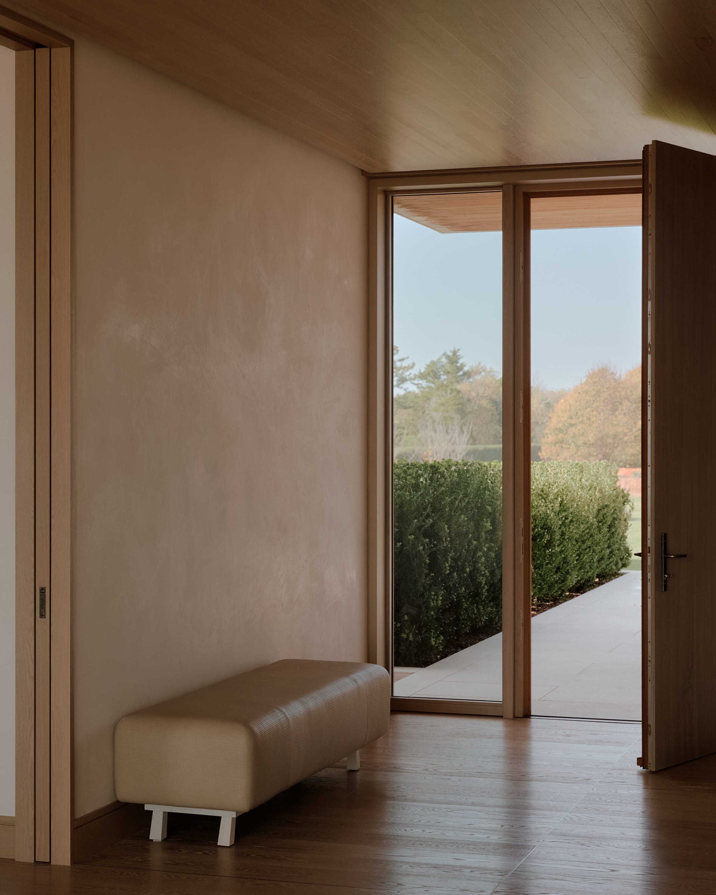 Exterior view of modern home with wood and glass.