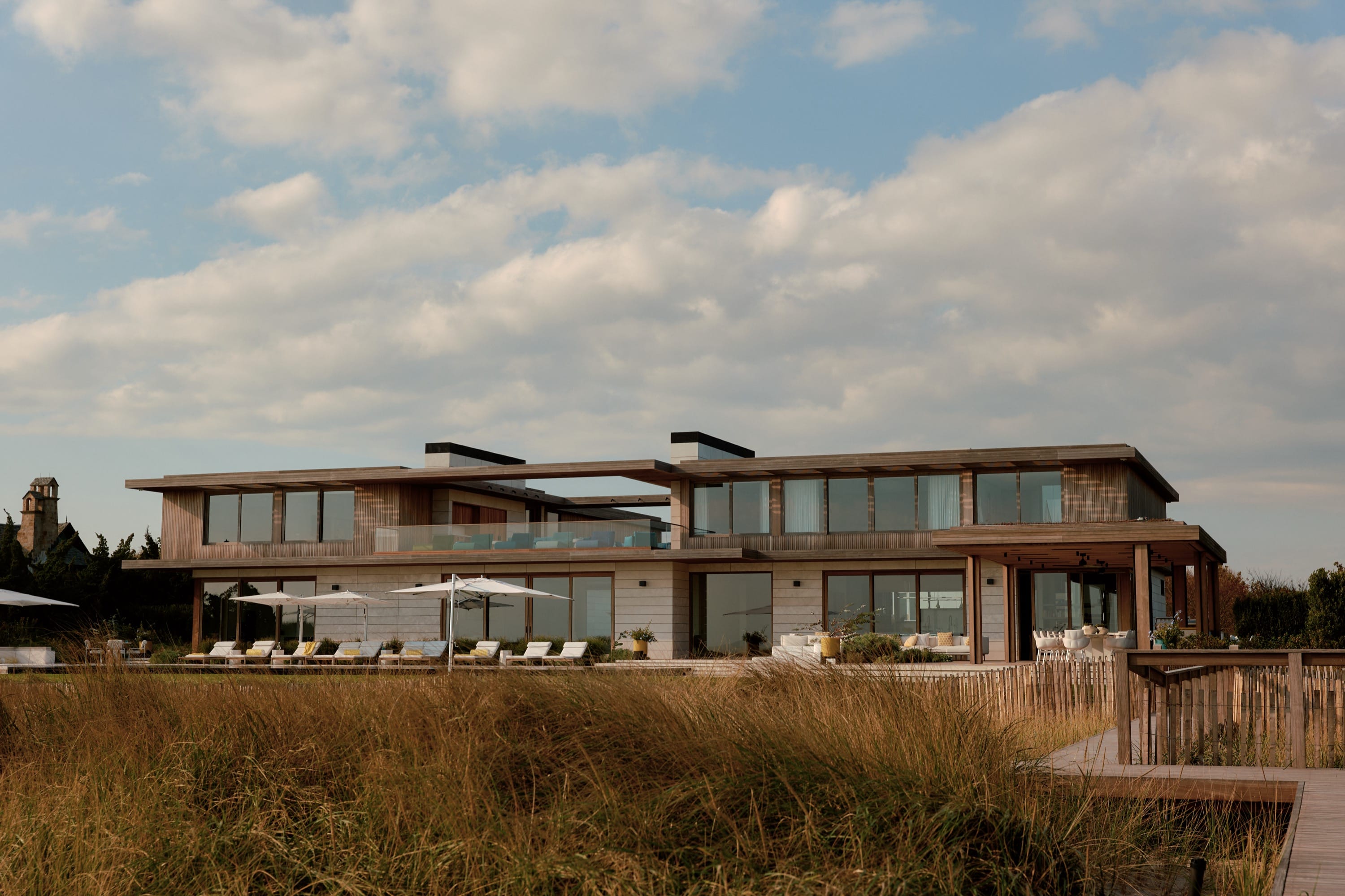 Exterior view of modern home with wood and glass.