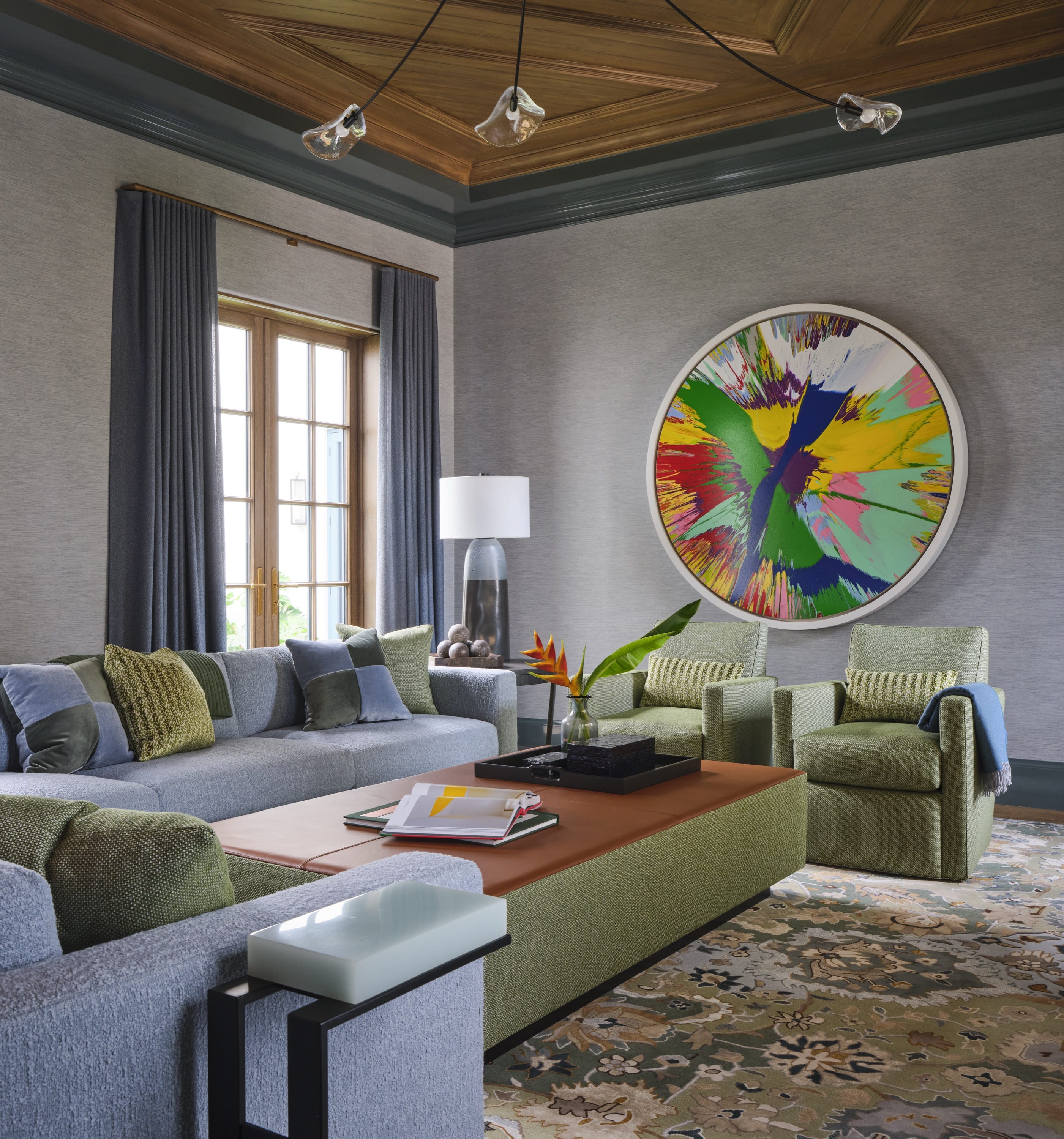 Game room with colorful art and modern furniture.