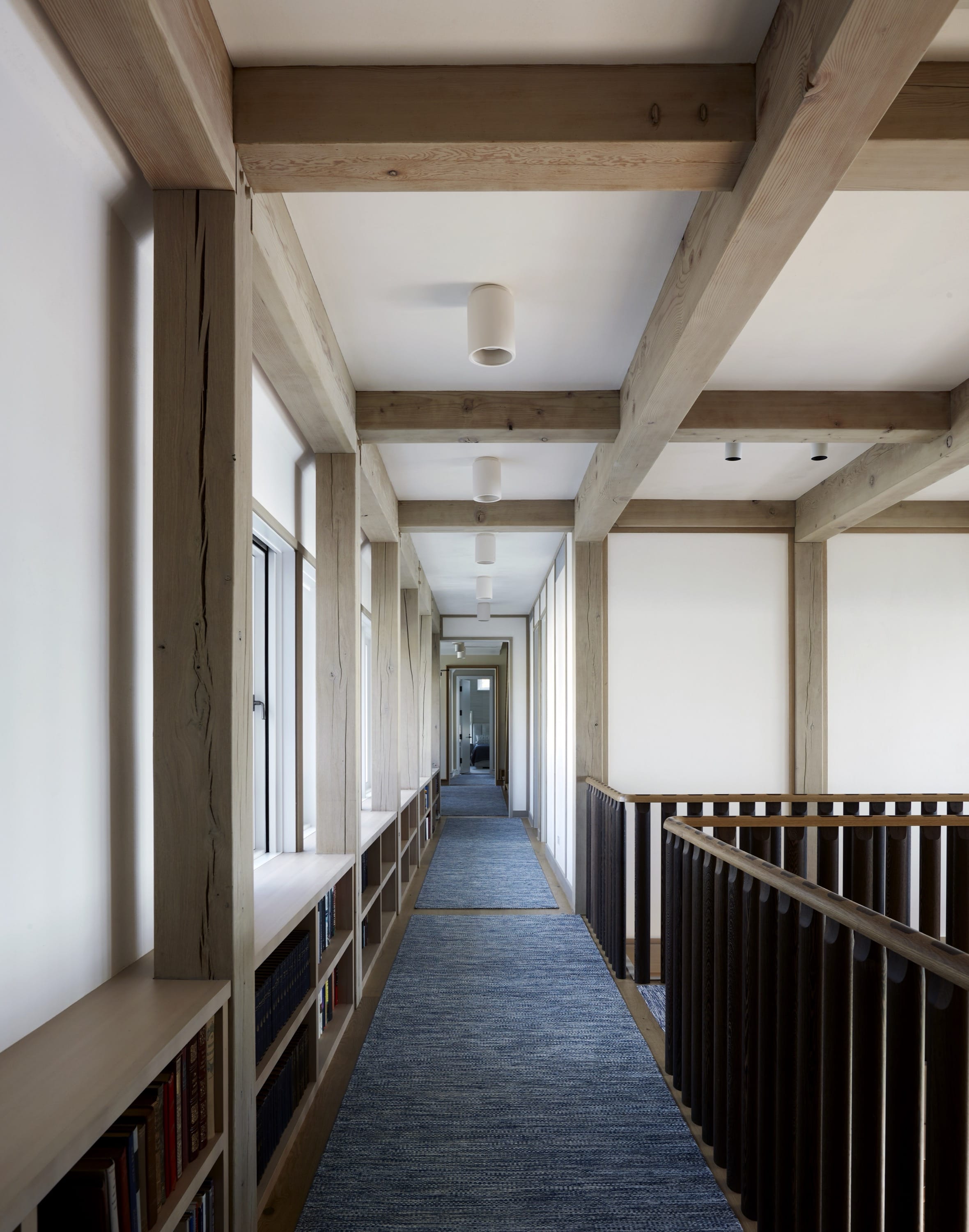 Hallway with wood beams and natural light.