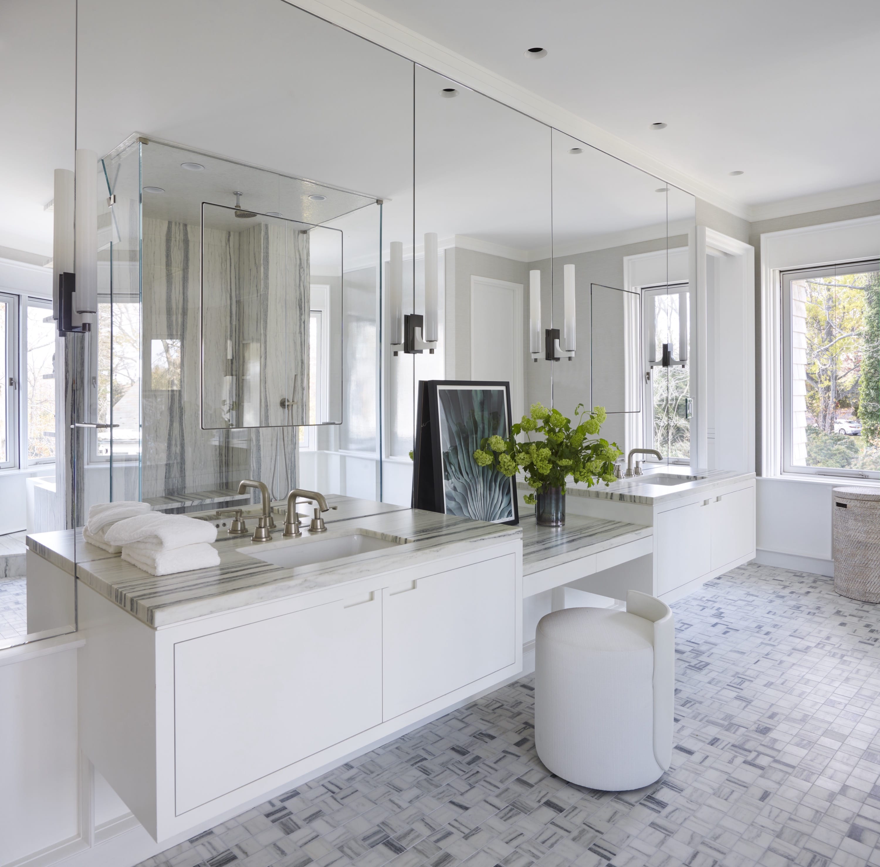 Bathroom with freestanding tub and glass shower.
