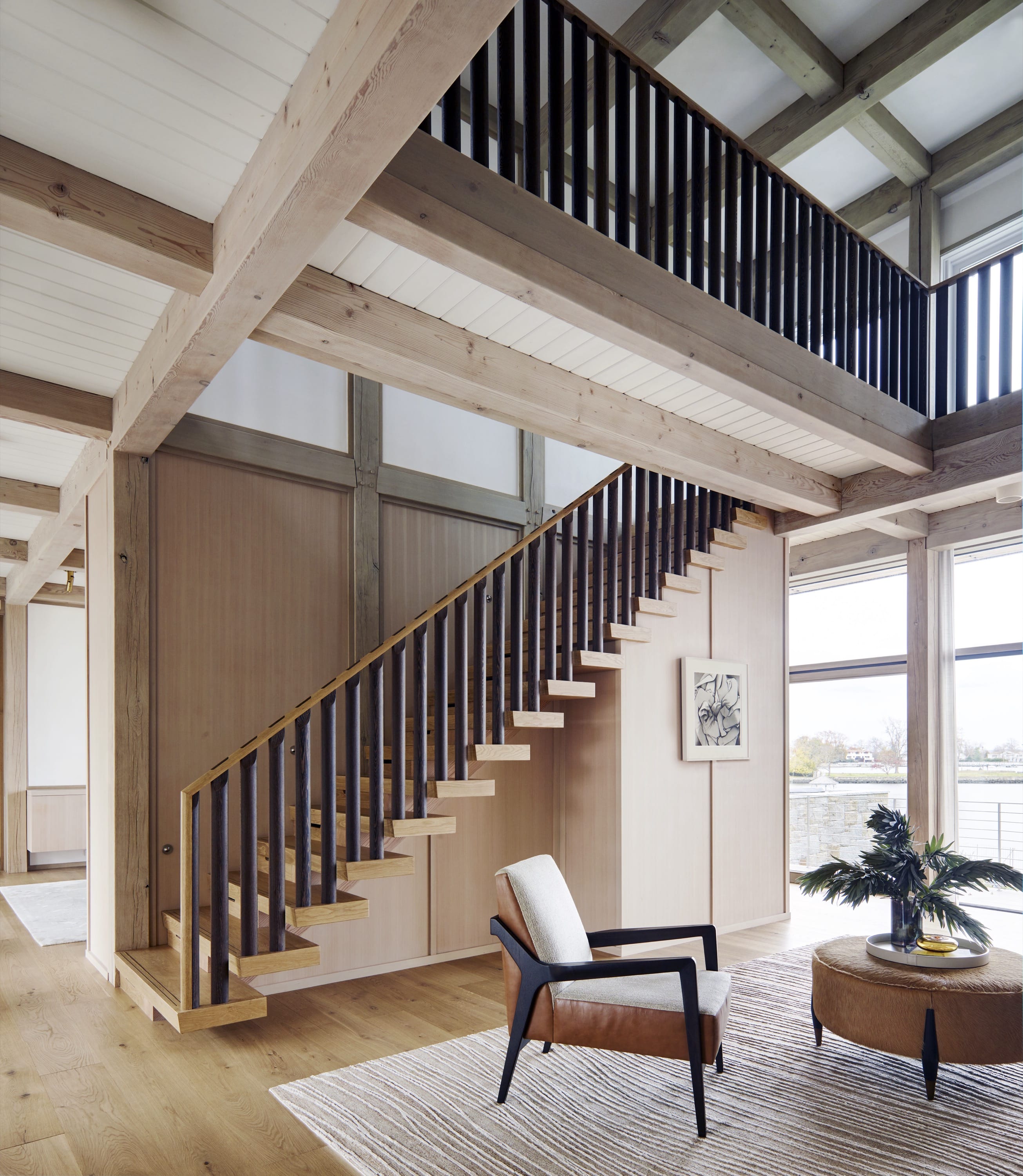 Staircase with wood beams and open railing.