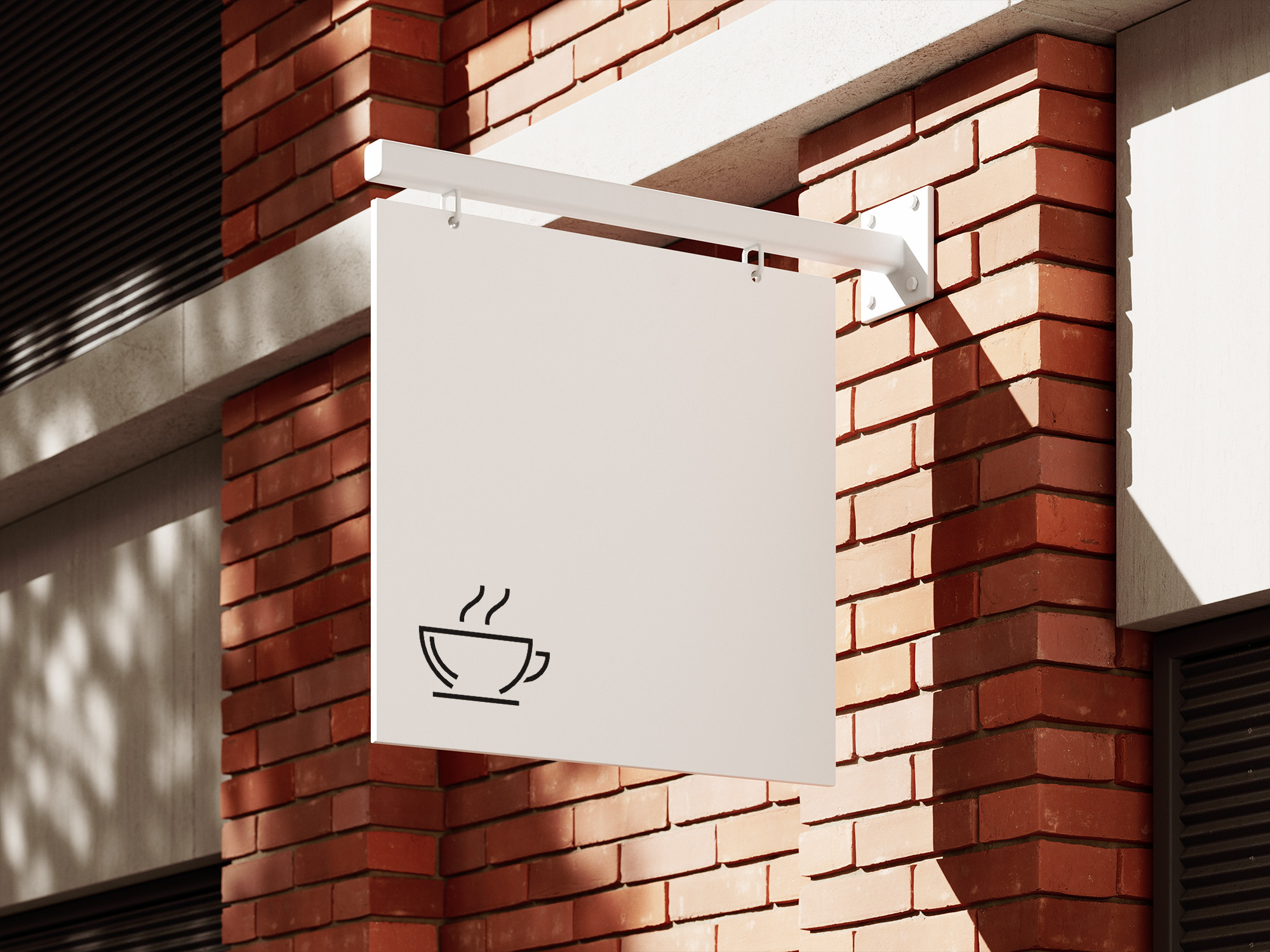 A white sign hanging from the side of a brick building.