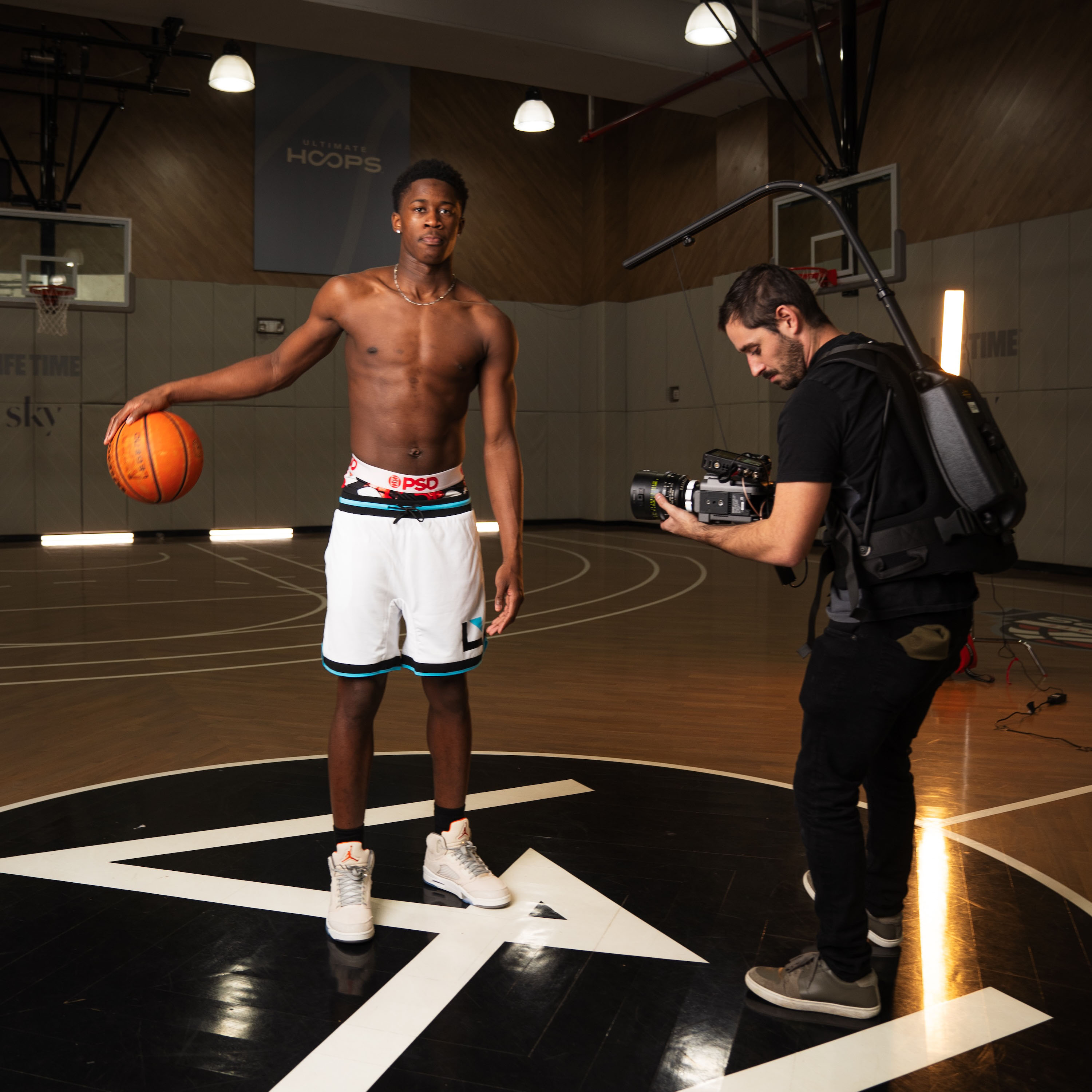 behind the scenes basketball player and camera man