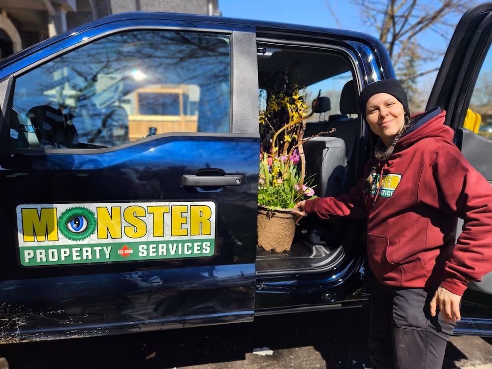 female worker holding a flower pot