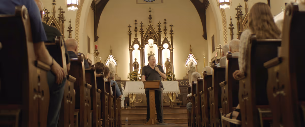 Kevin speaking to a parish community