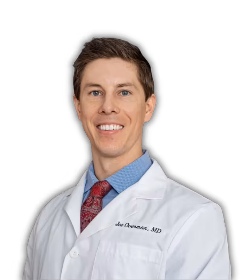 Portrait of Dr Joe Overman in white medical coat