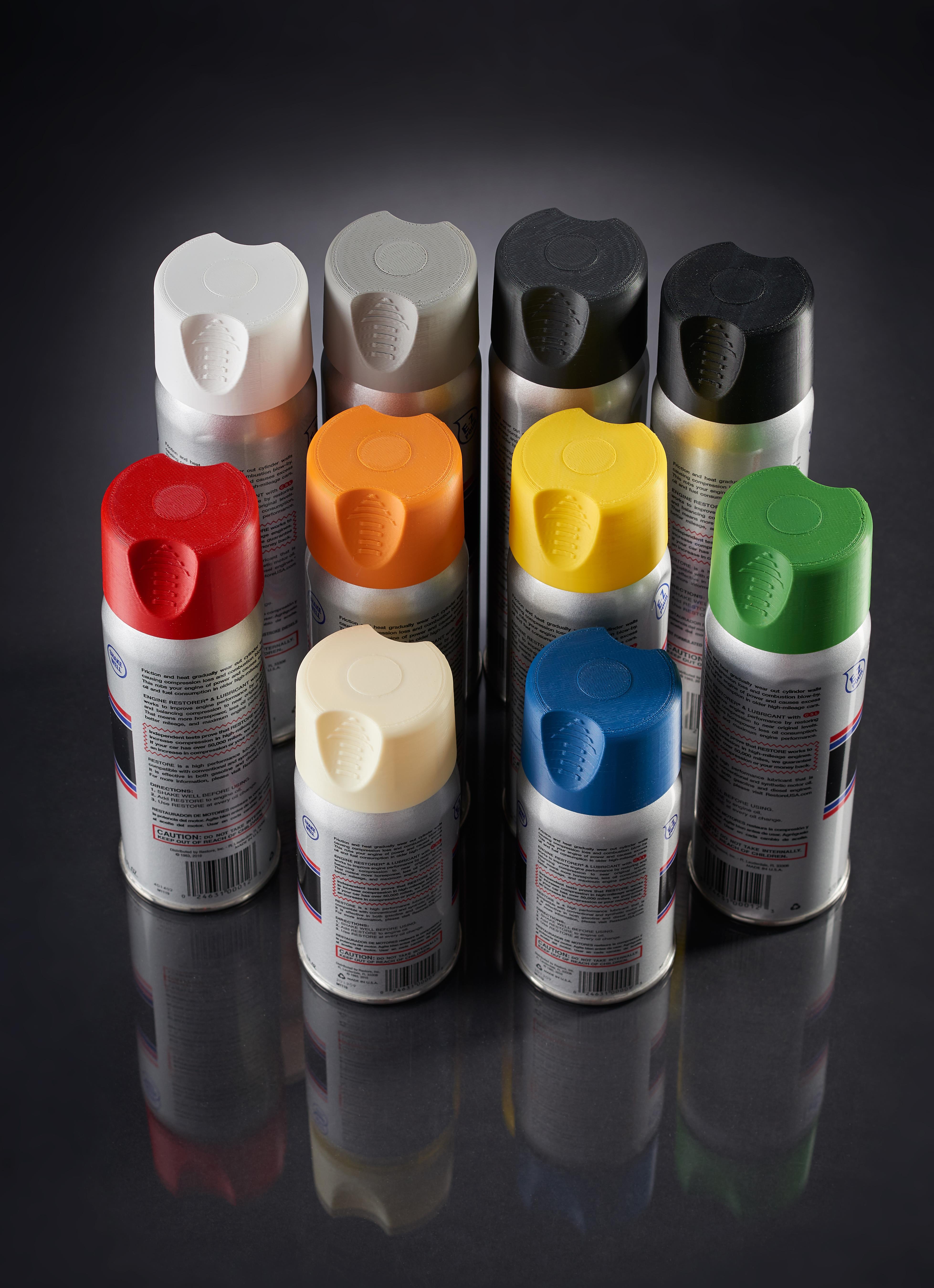 Ten spray paint cans arranged in a triangle with caps in white, gray, black, red, orange, yellow, green, cream, blue, and black colors.