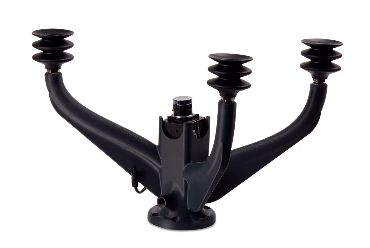 Black industrial vacuum gripper with three suction cups on curved arms used for robotic end-of-arm tooling.