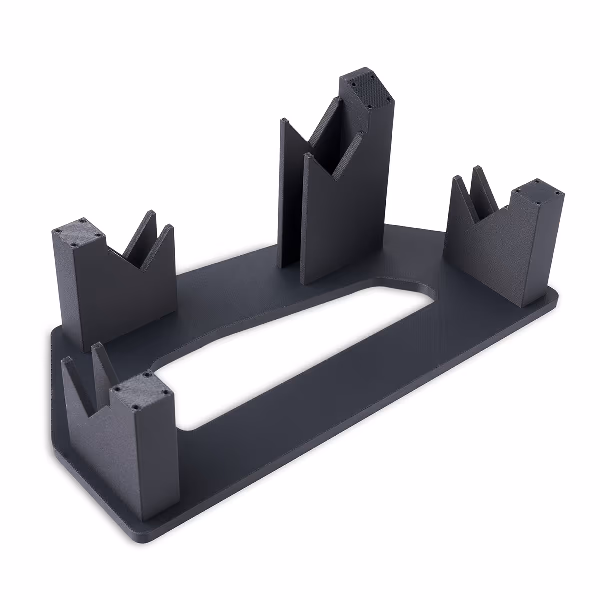 Black plastic pipe weld fixture with four upright V-shaped supports on a rectangular base.