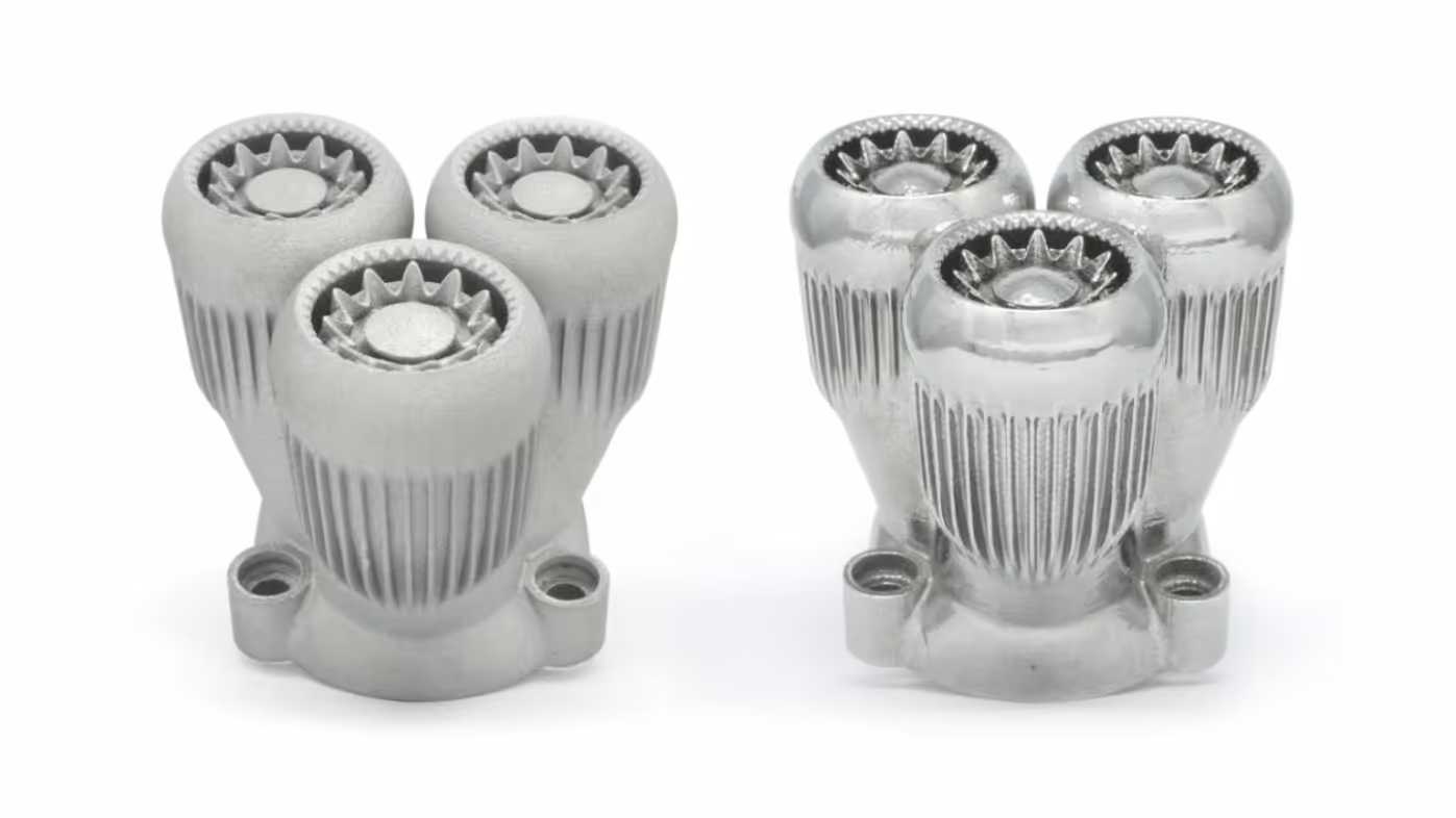 Two sets of three-pronged metallic turbine components side by side, one matte and one polished.