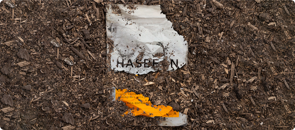 Compostable packaging from Hasbean coffee decomposing in soil