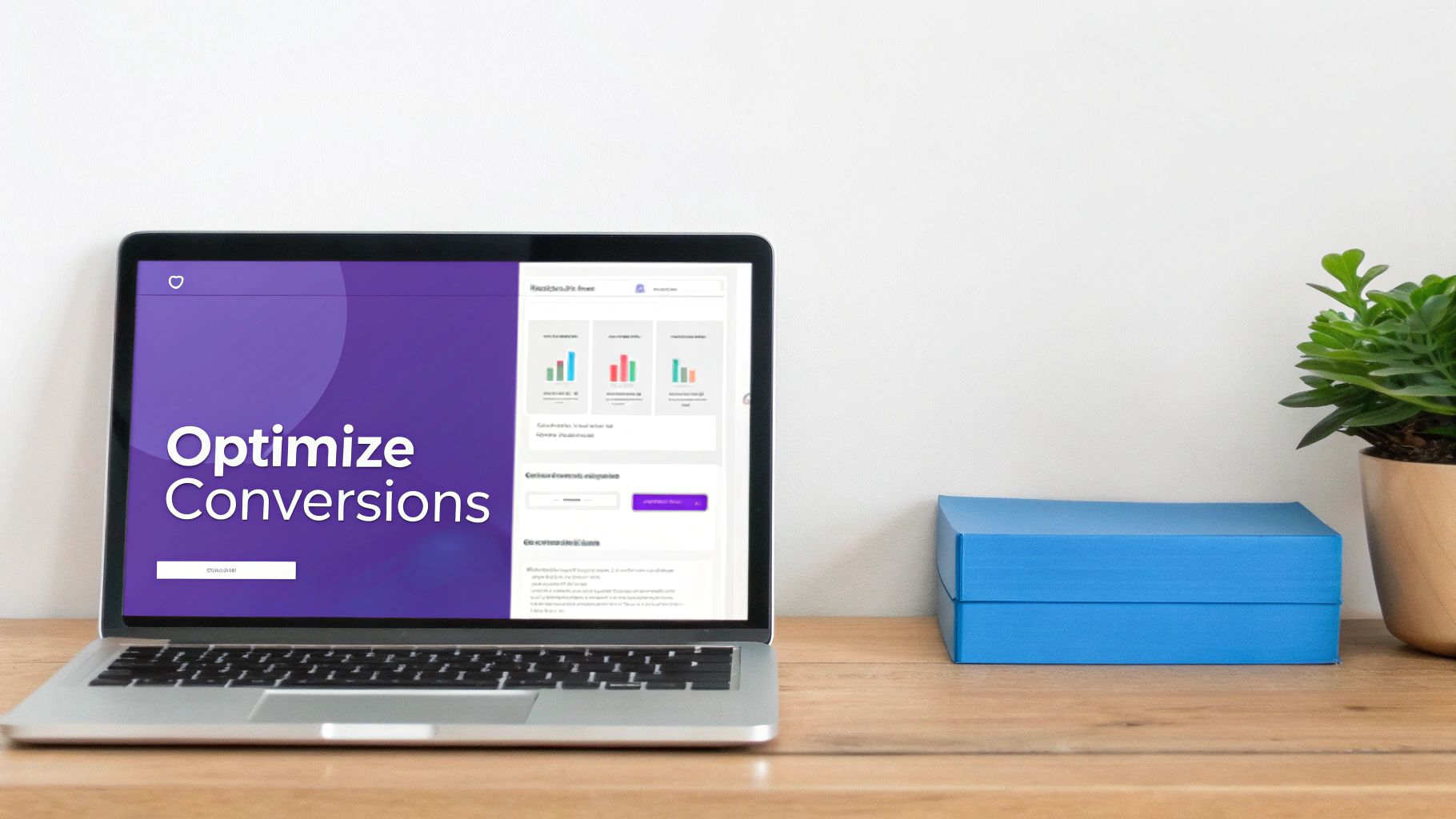 A laptop on a wooden desk displays a marketing dashboard with "Optimize Conversions" text. A plant and blue boxes are beside it.